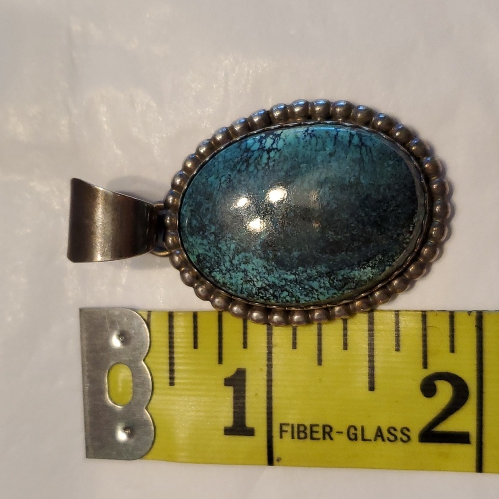 Turquoise and silver slide.